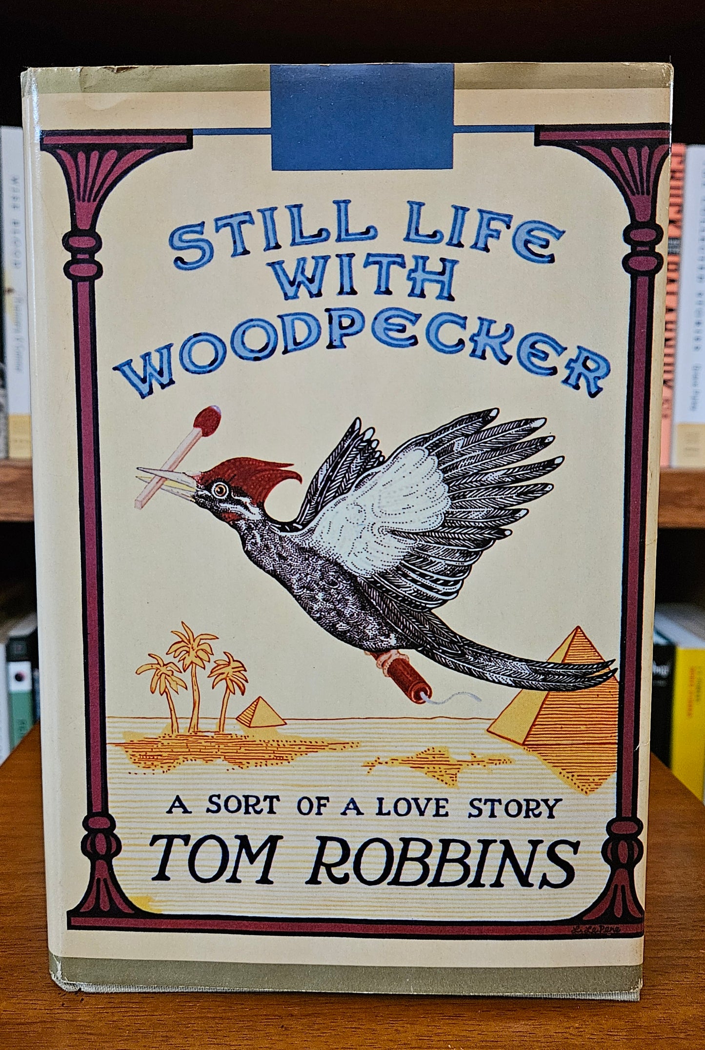 Tom Robbins - Still Life With Woodpecker (signed)